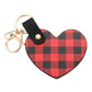 Red Buffalo Check Patterned Faux Leather Heart Bag Charm features a trendy buffalo check pattern and a heart-shaped design, adding a touch of style to any handbag. Made from durable faux leather, this charm is both fashionable and functional. Perfect for those who love to accessorize with unique pieces!