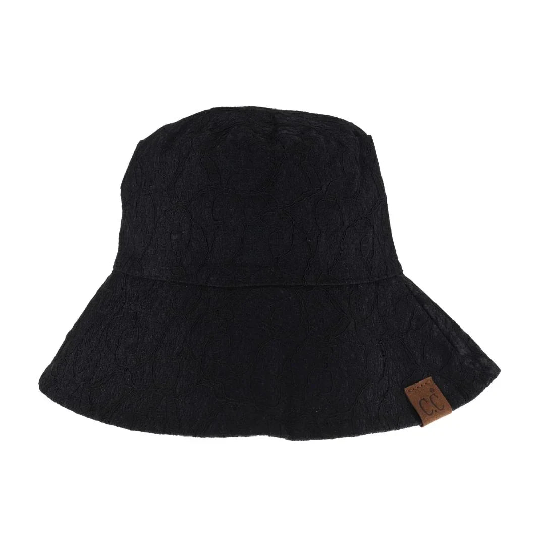 Black Reversible Lace C.C Bucket Hat combines sophisticated lace detailing with practical design, offering two distinct styles in one accessory. Crafted for durability and comfort, this hat features a breathable fabric that ensures a comfortable fit while providing sun protection. Its reversible nature allows seamless transition between a delicate lace look and a classic bucket hat style, making it a versatile addition to any wardrobe. Perfect for those who appreciate both elegance and functionality in thei