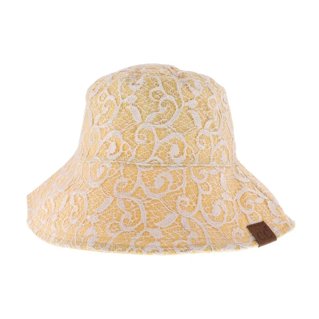 Honey-Mustard- Reversible Lace C.C Bucket Hat combines sophisticated lace detailing with practical design, offering two distinct styles in one accessory. Crafted for durability and comfort, this hat features a breathable fabric that ensures a comfortable fit while providing sun protection. Its reversible nature allows seamless transition between a delicate lace look and a classic bucket hat style, making it a versatile addition to any wardrobe. Perfect for those who appreciate both elegance and functionalit