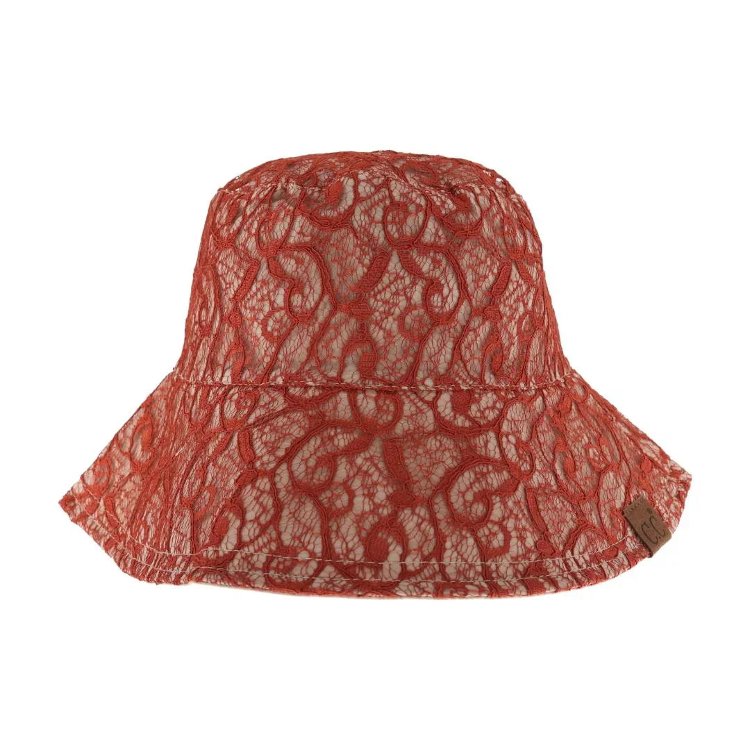Rust Reversible Lace C.C Bucket Hat combines sophisticated lace detailing with practical design, offering two distinct styles in one accessory. Crafted for durability and comfort, this hat features a breathable fabric that ensures a comfortable fit while providing sun protection. Its reversible nature allows seamless transition between a delicate lace look and a classic bucket hat style, making it a versatile addition to any wardrobe. Perfect for those who appreciate both elegance and functionality in their