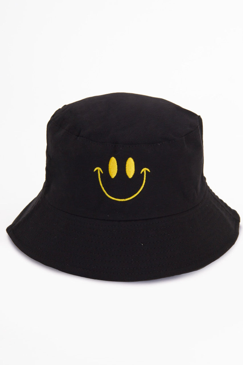 Black SMILE PRINT REVERSIBLE BUCKET HAT features a playful smile print design, offering two distinct looks in one versatile accessory. Constructed with quality materials for durability, it provides effective sun protection while adding a stylish, cheerful element to casual outfits. Perfect for outdoor activities or everyday wear. 