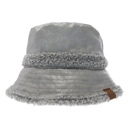 Grey Soft Faux Leather Shearling C.C Bucket Hat combines premium faux leather with a plush shearling lining to deliver exceptional warmth and comfort. Designed with a classic bucket silhouette, this hat offers a refined, expert-level accessory that enhances cold-weather outfits while providing durable protection against the elements. Its soft texture and thoughtful construction make it a sophisticated choice for those seeking both style and functionality. 
