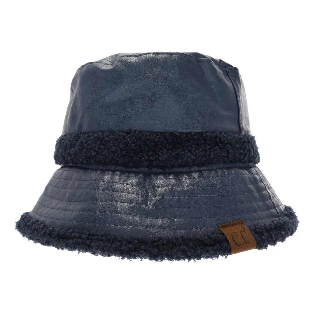indigo Soft Faux Leather Shearling C.C Bucket Hat combines premium faux leather with a plush shearling lining to deliver exceptional warmth and comfort. Designed with a classic bucket silhouette, this hat offers a refined, expert-level accessory that enhances cold-weather outfits while providing durable protection against the elements. Its soft texture and thoughtful construction make it a sophisticated choice for those seeking both style and functionality. 