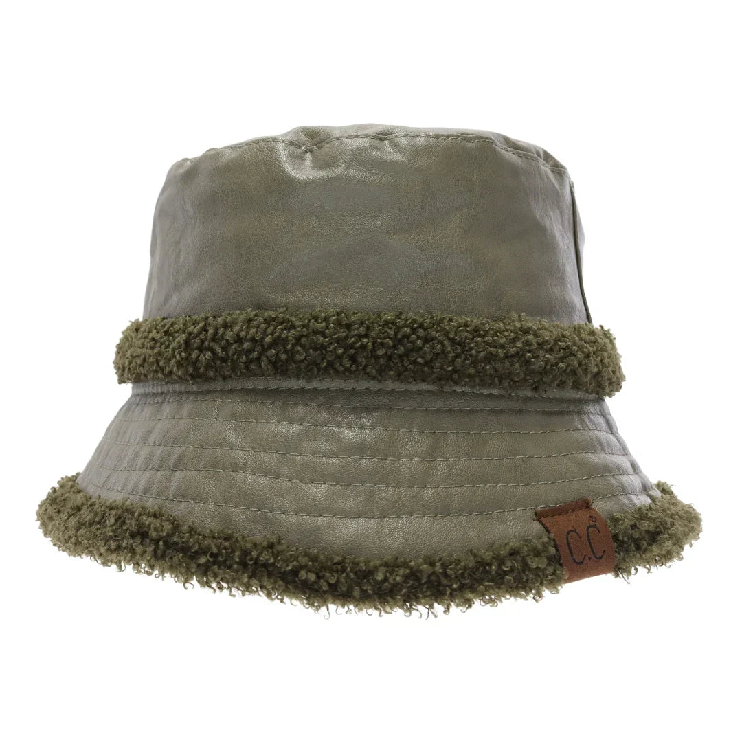Olive Soft Faux Leather Shearling C.C Bucket Hat combines premium faux leather with a plush shearling lining to deliver exceptional warmth and comfort. Designed with a classic bucket silhouette, this hat offers a refined, expert-level accessory that enhances cold-weather outfits while providing durable protection against the elements. Its soft texture and thoughtful construction make it a sophisticated choice for those seeking both style and functionality. 