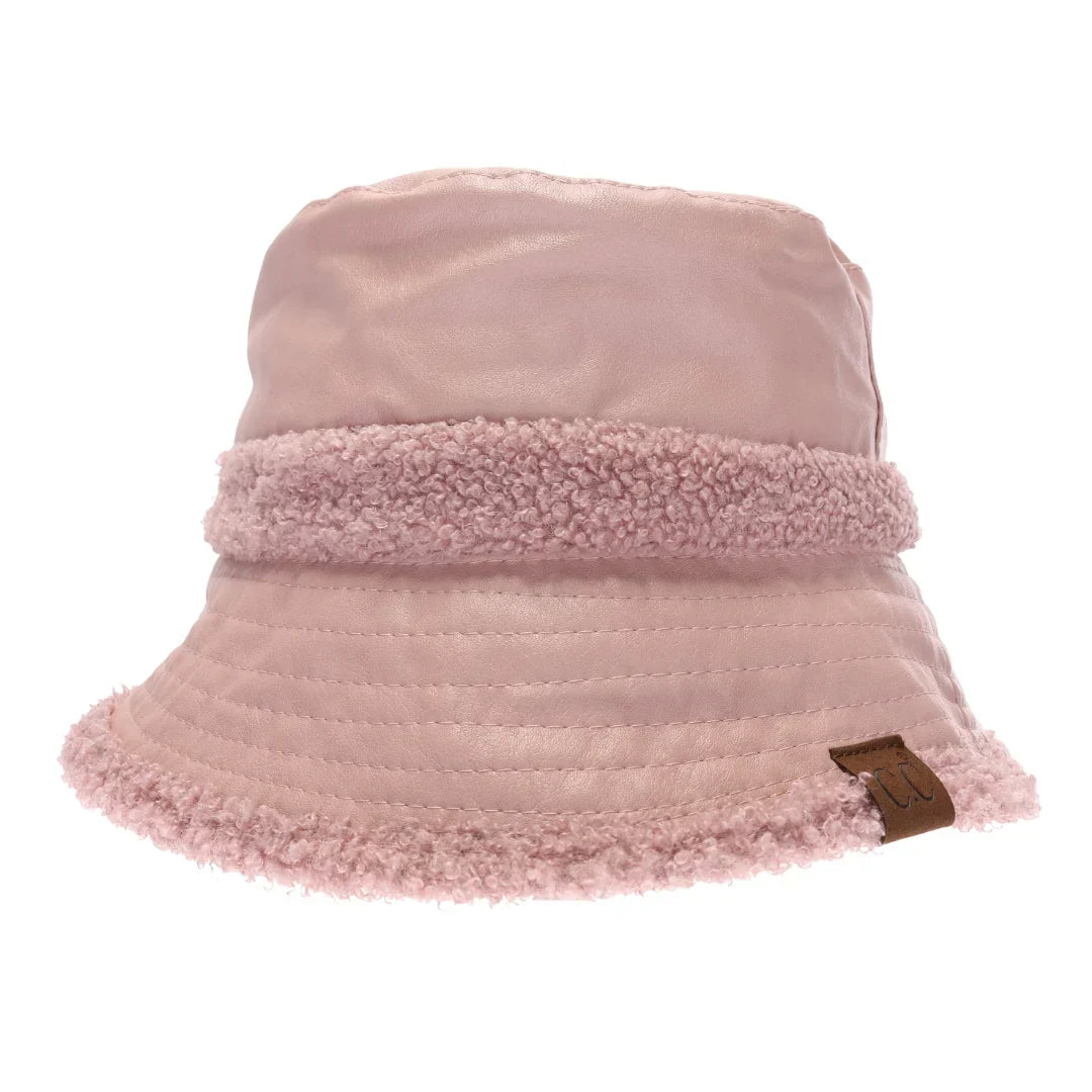 Rose Soft Faux Leather Shearling C.C Bucket Hat combines premium faux leather with a plush shearling lining to deliver exceptional warmth and comfort. Designed with a classic bucket silhouette, this hat offers a refined, expert-level accessory that enhances cold-weather outfits while providing durable protection against the elements. Its soft texture and thoughtful construction make it a sophisticated choice for those seeking both style and functionality. Soft Faux Leather Shearling C.C Bucket Hat combines 
