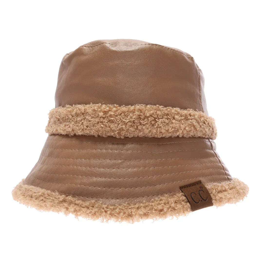 Almond Soft Faux Leather Shearling C.C Bucket Hat combines premium faux leather with a plush shearling lining to deliver exceptional warmth and comfort. Designed with a classic bucket silhouette, this hat offers a refined, expert-level accessory that enhances cold-weather outfits while providing durable protection against the elements. Its soft texture and thoughtful construction make it a sophisticated choice for those seeking both style and functionality. 