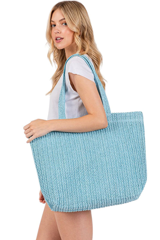 Blue Solid Color Crochet Summer Straw Tote Bag combines timeless craftsmanship with practical design. Handwoven from durable straw, its crochet pattern offers breathability and lightweight comfort, making it ideal for warm-weather outings. The spacious interior accommodates essentials effortlessly, while the sturdy handles ensure easy carrying. Perfect for beach trips, casual strolls, or everyday use, this tote blends style and function for a refined summer accessory. 