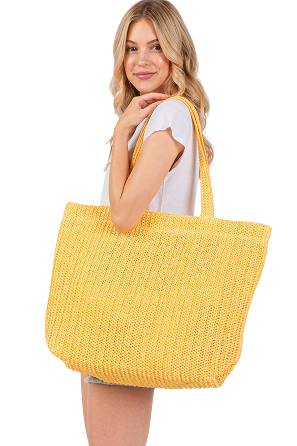 Yellow Solid Color Crochet Summer Straw Tote Bag combines timeless craftsmanship with practical design. Handwoven from durable straw, its crochet pattern offers breathability and lightweight comfort, making it ideal for warm-weather outings. The spacious interior accommodates essentials effortlessly, while the sturdy handles ensure easy carrying. Perfect for beach trips, casual strolls, or everyday use, this tote blends style and function for a refined summer accessory. 