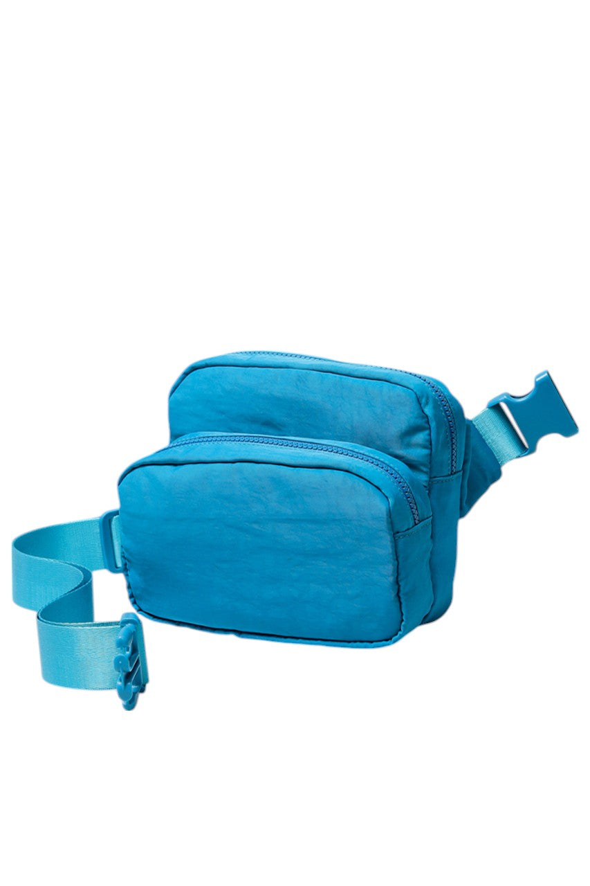 Solid Double Zipper Fanny Pack offers practical organization with two separate compartments, allowing you to store essentials while keeping them easily accessible and secure. Its durable construction ensures long-lasting use, making it ideal for travel, outdoor activities, or daily errands. The adjustable strap provides a comfortable fit, combining convenience and functionality in a sleek, minimalist design.