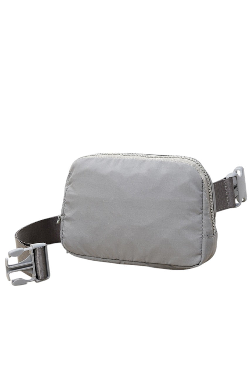 Solid Mini Fanny Belt Bag offers a compact and practical solution for hands-free carrying. Designed with durability and convenience in mind, its streamlined silhouette fits essentials securely while complementing a variety of styles. Ideal for active lifestyles, this belt bag ensures easy access and comfort without bulk, making it a versatile accessory for daily use or travel. 