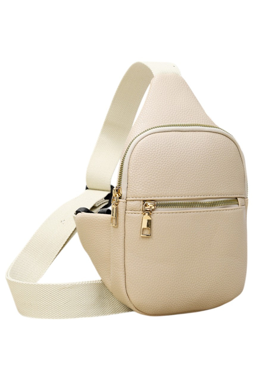 Solid PU Sling Bag combines durability with sleek design, crafted from high-quality polyurethane for a lightweight yet sturdy feel. Its compact size and adjustable strap offer comfortable, hands-free carrying, making it ideal for daily use or travel. The bag’s minimalist style ensures versatility, complementing various outfits while securely holding essentials. Perfect for those seeking a practical and stylish accessory with expert craftsmanship.
