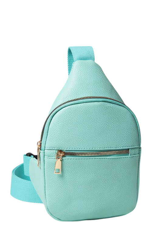 Solid PU Sling Bag combines durability with sleek design, crafted from high-quality polyurethane for a lightweight yet sturdy feel. Its compact size and adjustable strap offer comfortable, hands-free carrying, making it ideal for daily use or travel. The bag’s minimalist style ensures versatility, complementing various outfits while securely holding essentials. Perfect for those seeking a practical and stylish accessory with expert craftsmanship.