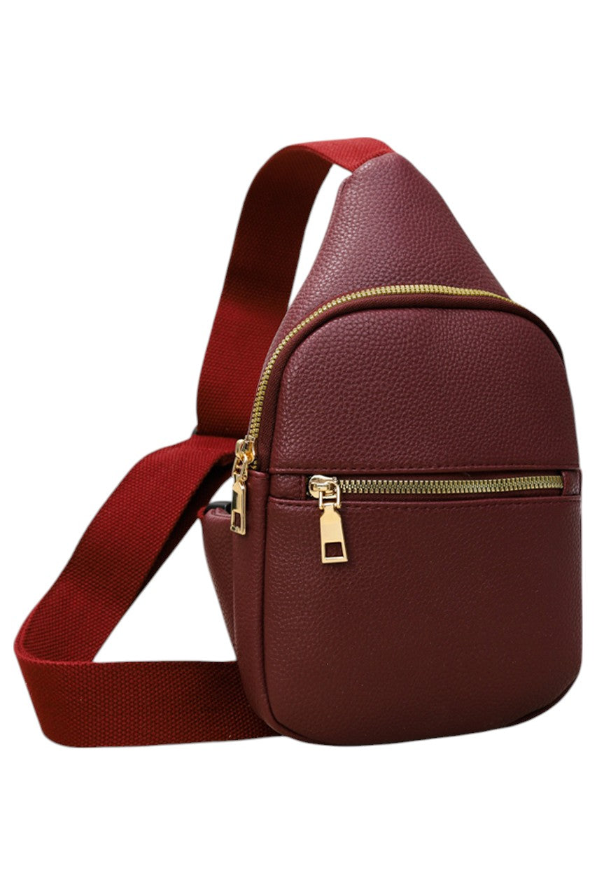 Solid PU Sling Bag combines durability with sleek design, crafted from high-quality polyurethane for a lightweight yet sturdy feel. Its compact size and adjustable strap offer comfortable, hands-free carrying, making it ideal for daily use or travel. The bag’s minimalist style ensures versatility, complementing various outfits while securely holding essentials. Perfect for those seeking a practical and stylish accessory with expert craftsmanship.