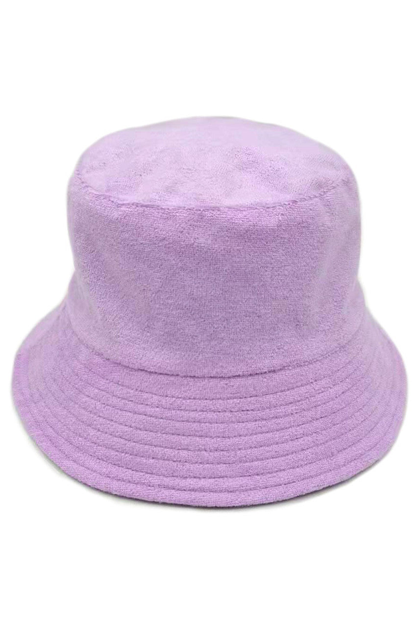 Lavender TERRY BUCKET HAT features a specialized looped fabric structure that enhances moisture absorption by increasing surface contact. Its precisely engineered seam design evenly distributes tension, helping maintain the hat’s shape during extended wear. The crown depth is scientifically calibrated to ensure a secure and consistent fit across different head sizes, while the reinforced brim holds its shape and protective angle in a variety of conditions. Designed with breathability in mind, the hat promot