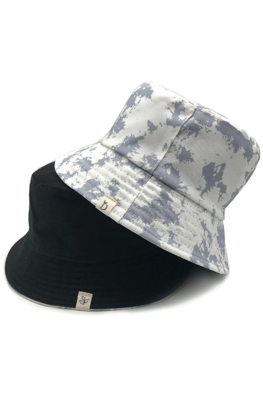 Gray Tie Dye Bucket Hat features a professionally executed color pattern with exceptional color retention. The structured design maintains its shape while providing optimal sun protection with a 2.5-inch brim. Constructed from high-density cotton fabric, it offers breathability and comfort during extended wear, making it an essential accessory for fashion-forward outdoor enthusiasts. 