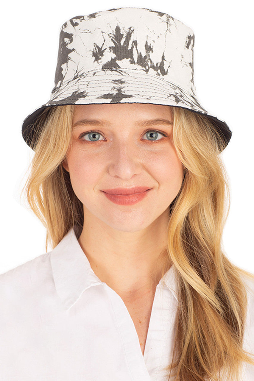 Black TIE DYE REVERSIBLE BUCKET HAT features vibrant tie-dye patterns that deliver two distinct looks in one versatile accessory. Constructed with premium materials for durability, it provides effective sun protection while making a bold fashion statement. Perfect for festivals, beach outings, or adding a touch of artistic flair to everyday ensembles. 