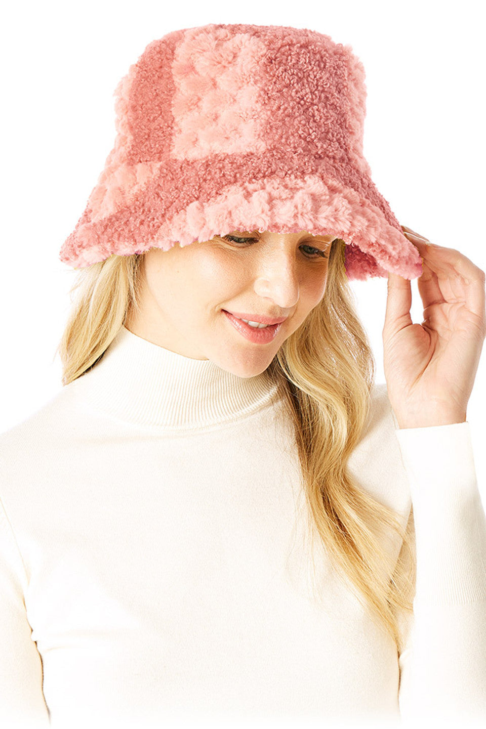 Pink Two Tone Faux Fur Bucket Hat combines luxurious texture with contemporary design. The dual-color pattern adds visual dimension, while premium faux fur construction ensures warmth without compromising on ethical standards. The classic bucket silhouette offers practical coverage with a fashion-forward edge, making it an essential accessory for elevating winter wardrobes.