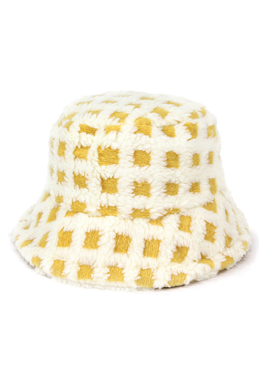 Ivory Two Tone Faux Fur Checkered Bucket Hat combines sophisticated design with practical warmth. Featuring a distinctive checkered pattern in dual-tone faux fur, it offers superior insulation while maintaining a fashion-forward aesthetic. The structured bucket silhouette provides optimal coverage and retains its shape throughout wear, making it an essential accessory for discerning winter wardrobes. 