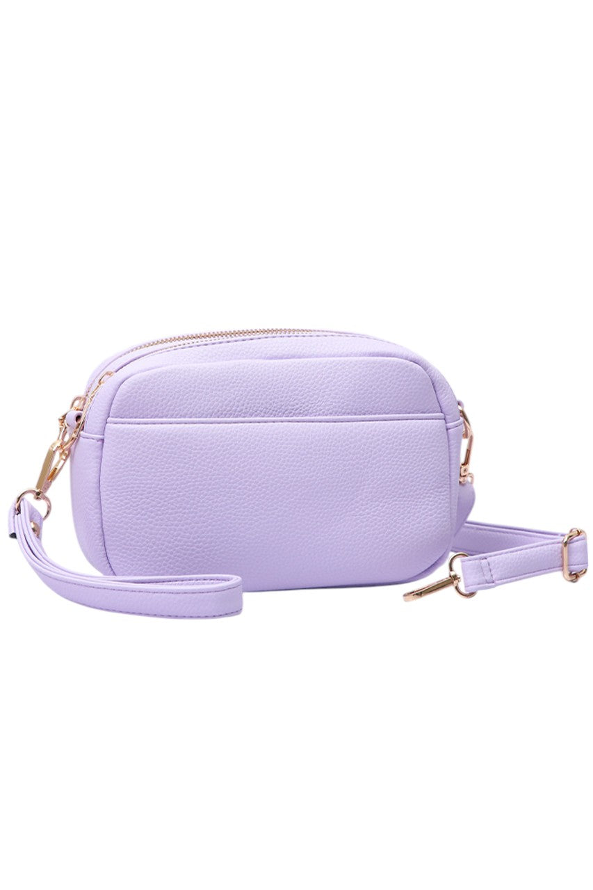 Light Purple Two Zipper Solid PU Crossbody Bag combines practical design with durable materials. Crafted from high-quality PU leather, it offers a sleek, solid finish that resists wear. Featuring two separate zippered compartments, it provides organized storage for essentials, making it ideal for daily use or travel. The adjustable crossbody strap ensures comfortable, hands-free carrying, while the minimalist design complements a variety of styles with professional ease. 