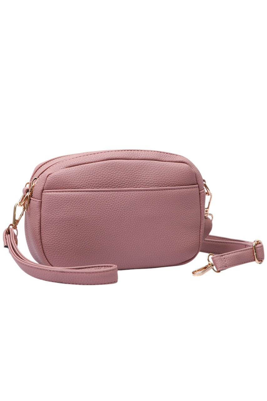 Pink Two Zipper Solid PU Crossbody Bag combines practical design with durable materials. Crafted from high-quality PU leather, it offers a sleek, solid finish that resists wear. Featuring two separate zippered compartments, it provides organized storage for essentials, making it ideal for daily use or travel. The adjustable crossbody strap ensures comfortable, hands-free carrying, while the minimalist design complements a variety of styles with professional ease. 