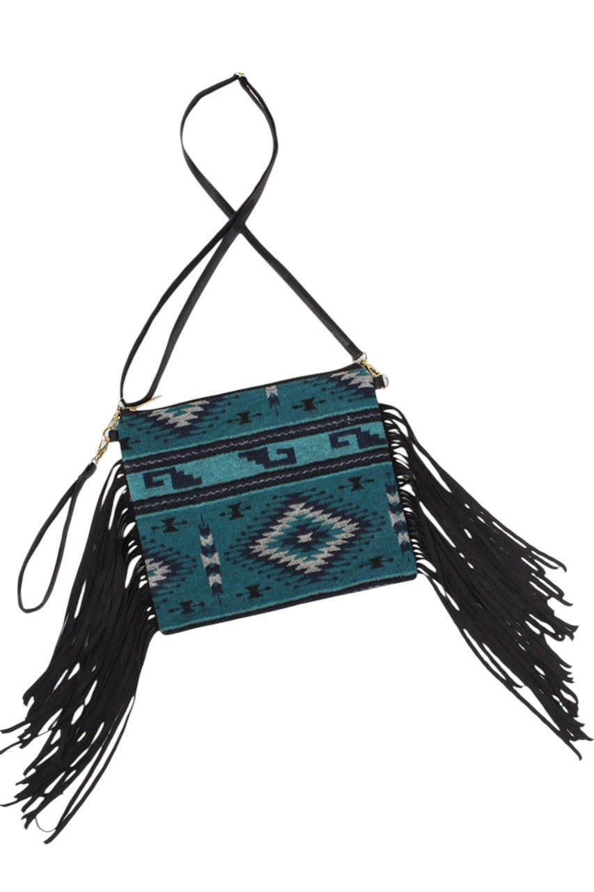 Teal Western Tassel Crossbody Bag combines classic western style with practical design. Crafted for durability and ease of use, it features a secure crossbody strap for hands-free convenience and decorative tassels that add a distinctive flair. Ideal for everyday wear, this bag offers ample space to organize essentials while complementing a variety of outfits with its timeless, expert-crafted aesthetic. 