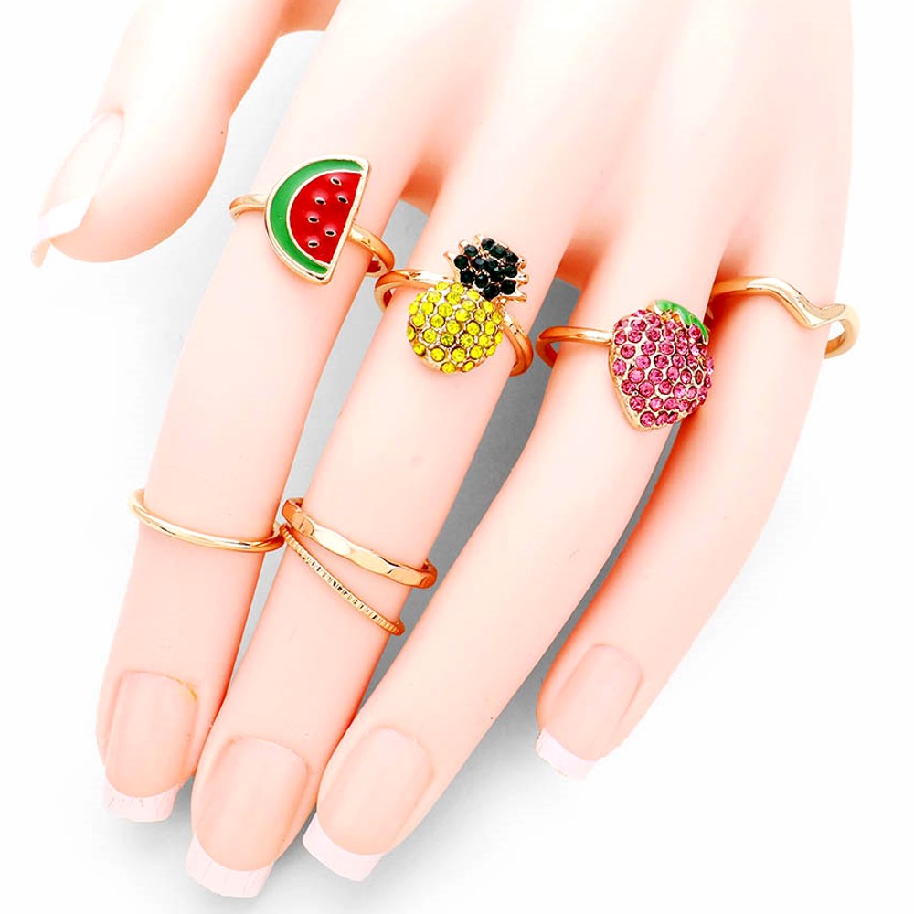 7pc Set Crystal Embellished Pineapple, Strawberry, Enameled Watermelon, Metal Rings, add a sweet treat to your look, this set of rings will show your tropical and fruity side ideal for any summer get together and embrace the beauty of nature and add the perfect pop of detail to your look. • Color: Gold • Theme : Fruits/Food • Size : 0.1" H - 0.7" H