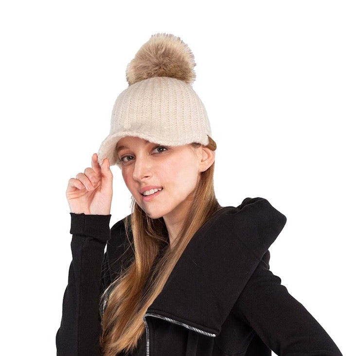 Beige C.C Cable Knitted Brim Beanie Natural Faux Fur Pom Pom Warm Winter Hat; reach for this classic toasty hat to keep you nice and warm in the chilly winter weather, the wintry touch finish to your outfit. Perfect Gift Birthday, Christmas, Holiday, Anniversary, Stocking Stuffer, Secret Santa, Valentines Day, Loved One, BFF