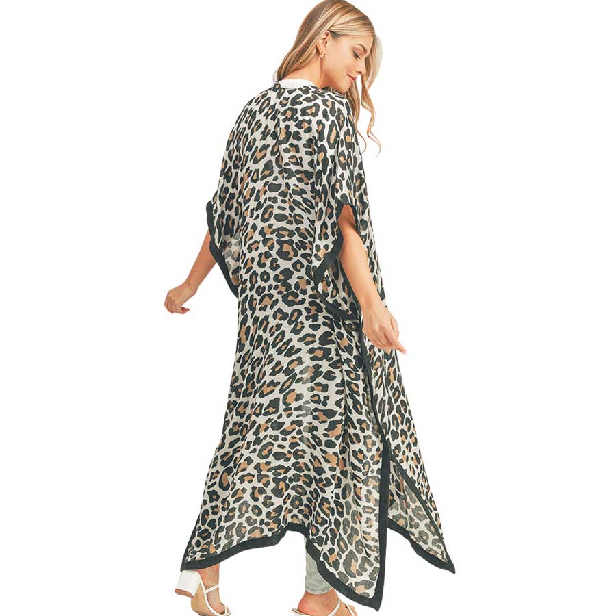 Beige Leopard Patterned Cover Up Kimono Poncho, this timeless leopard patterned kimono Poncho is soft, lightweight, and breathable fabric, close to the skin, and comfortable to wear. Sophisticated, flattering, and cozy. look perfectly breezy and laid-back as you head to the beach. A fashionable eye-catcher will quickly become one of your favorite accessories.