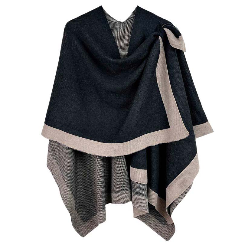 Black Bordered Ruana With Shoulder Strap, is beautifully designed with a border and shoulder strap that will absolutely accent your outlook to a greater extent and keeps you warm and comfortable on cold days. The shoulder strap is so unique and attractive that will surely make you stand out with a unique yet trendy style. It will keep you perfectly warm and toasty everywhere saving you from cold and chill on the outside.
