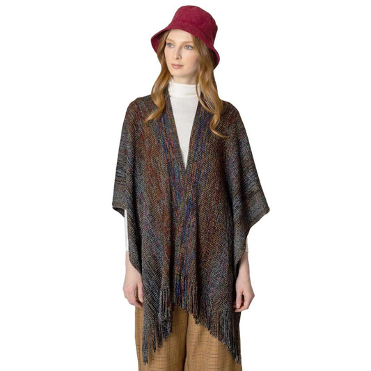 Black Multi Colored Metallic Knit Ruana, you can draw attention to the contrast of different outfits. Awesome multi-colored knit Ruana with a Fringe design that gives it a unique decorative and modern look. Match well with jeans and T-shirts or a vest. A fashionable, eye catcher, and useful wear that will quickly become one of your favorite accessories. It keeps you perfectly warm and goes well with all your winter outfits. Enjoy the winter in style!