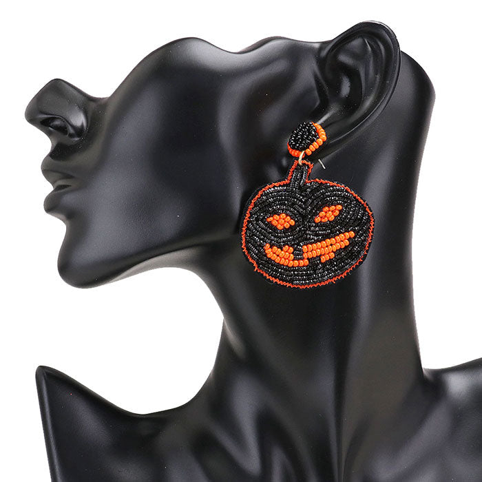 Black Seed Bead Pumpkin Earrings. Share the spirit of Halloween with our extra spooky Felt Back Seed Beaded Pumpkin Dangle Earrings. These Earrings are made to scare people off! Halloween is the time of year where there is magic in the night when pumpkins glow with candlelight. Just the thing you need to perfect your Halloween costume! Let the spooky season begin! Happy Halloween!