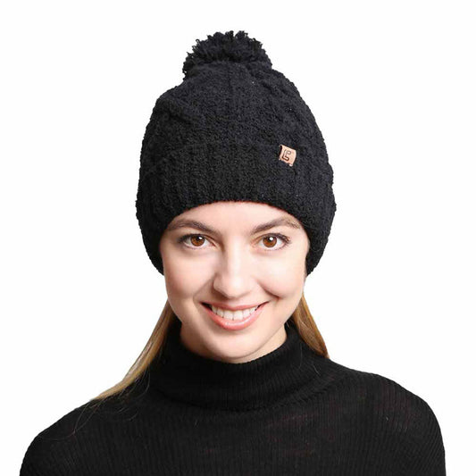 Black Solid Color Cable Knit Beanie. Accessorize the fun way with this pom cable knit Beanie. The autumnal touch you need to finish your outfit in style. Cable knit Beanie made with warm poly microfiber to ensure maximum comfort and durability. Ideal winter head cover! Comes in one size winter cap with a pom that fits most head sizes. Absolutely the perfect gift winter accessory!