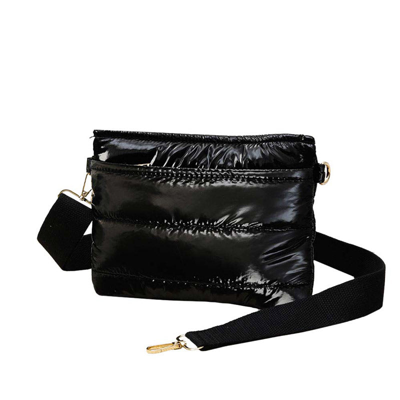 Black Glossy Solid Puffer Crossbody Bag, Complete the look of any outfit on all occasions with this Shiny Puffer Crossbody Bag. This Puffer bag offers enough room for your essentials. With a One Front Zipper Pocket, One Back Zipper Pocket, and a Zipper closure at the top, this bag will be your new go-to! The zipper closure design ensures the safety of your property. The widened shoulder straps increase comfort and reduce the pressure on the shoulder.