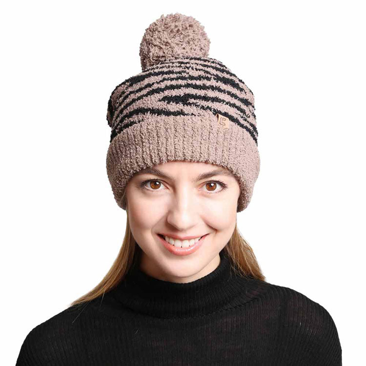 Brown Zebra Lined Pom Pom Beanie. These awesome trendy women’s Beanie With Faux Fur Pom are Warm, durable and comfortable. This will be your go-to beanie this fall and winter season. These zebra themed beannie has classic style that allows you to enhance your outfit, no matter your wardrobe. Accessorize the fun way with this faux fur pom pom hat, Awesome winter gift accessory! Perfect Gift Birthday, Christmas, Stocking Stuffer, Secret Santa, Holiday, Anniversary, Valentine's Day, Loved One.