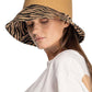 C.C Zebra Print Cloche Straw Bucket Hat. Keep your styles on even when you are relaxing at the pool or playing at the beach. Large, comfortable, and perfect for keeping the sun off of your face, neck, and shoulders Perfect summer, beach accessory. Ideal for travelers who are on vacation or just spending some time in the great outdoors.