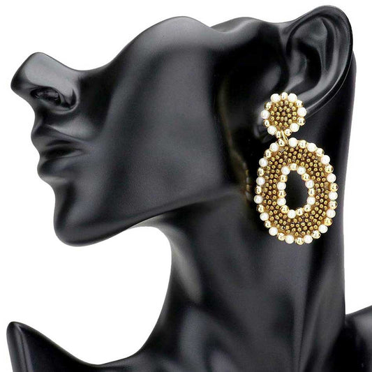 Cream Pearl Metal Ball Cluster Open Oval Dangle Earrings. The perfect assortment of beautiful earrings, pair these glitzy dangle with any ensemble for a polished & sophisticated look. Ideal for dates, Birthday Gift, Anniversary Gift, Mother's Day Gift, Graduation Gift, Just Because Gift, Thank you Gift.