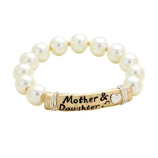 Cream Worn (Gold Silver) Mother & Daughter heart message bar pearl stretch bracelet. Express your love to your loving mother with this bracelets, reminding her that you’ll always cherish her as your first caregiver.  Mom & Daughter charm bracelets Collection shows her how much you care every day or on special occasions like her birthday, Anniversary Gift, Valentine’s Day, Mother’s Day or Christmas!