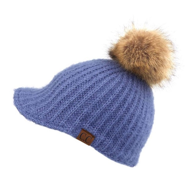 Dark Denim C.C Cable Knitted Brim Beanie Natural Faux Fur Pom Pom Warm Winter Hat; reach for this classic toasty hat to keep you nice and warm in the chilly winter weather, the wintry touch finish to your outfit. Perfect Gift Birthday, Christmas, Holiday, Anniversary, Stocking Stuffer, Secret Santa, Valentines Day, Loved One, BFF