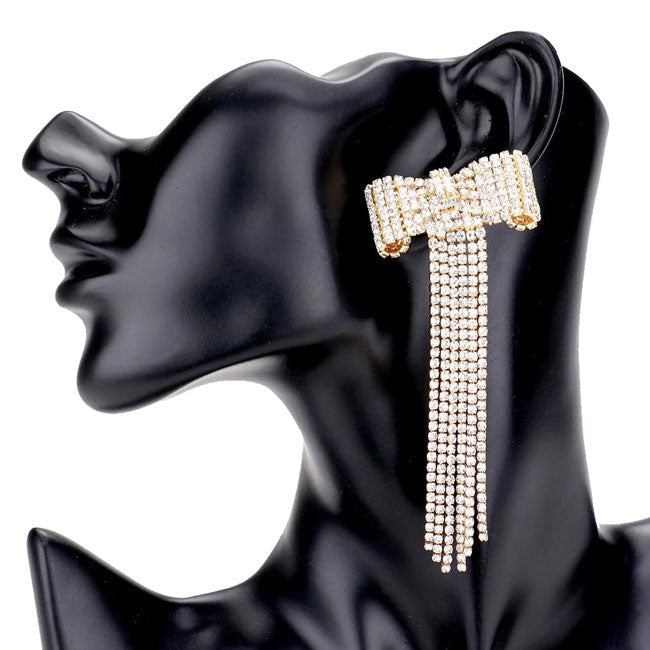 Gold Bow Accented Rhinestone Long Drop Evening Earrings. Elegance becomes you in these lightweight and playful, shiny glamorous Rhinestone earrings, the perfect sparkling accessory to add some sophisticated fun to your next social event. Coordinate this evening earrings with any ensemble from business casual wear, the perfect addition to every outfit.