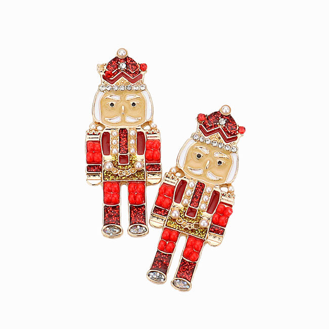 Gold Red Enamel Stone Embellished Nutcracker Earrings. Are you looking for some cute and fun earrings for Christmas! You'll love these fun Christmas nutcracker earrings. These cute Christmas earrings will decorate your Christmas costumes or outfits with statement. They will make them more exciting and eye-catching! Christmas earrings can be used in Christmas, New Year parties and other joyous occasions. Awesome gift idea to give someone who loves the magic of Christmas.