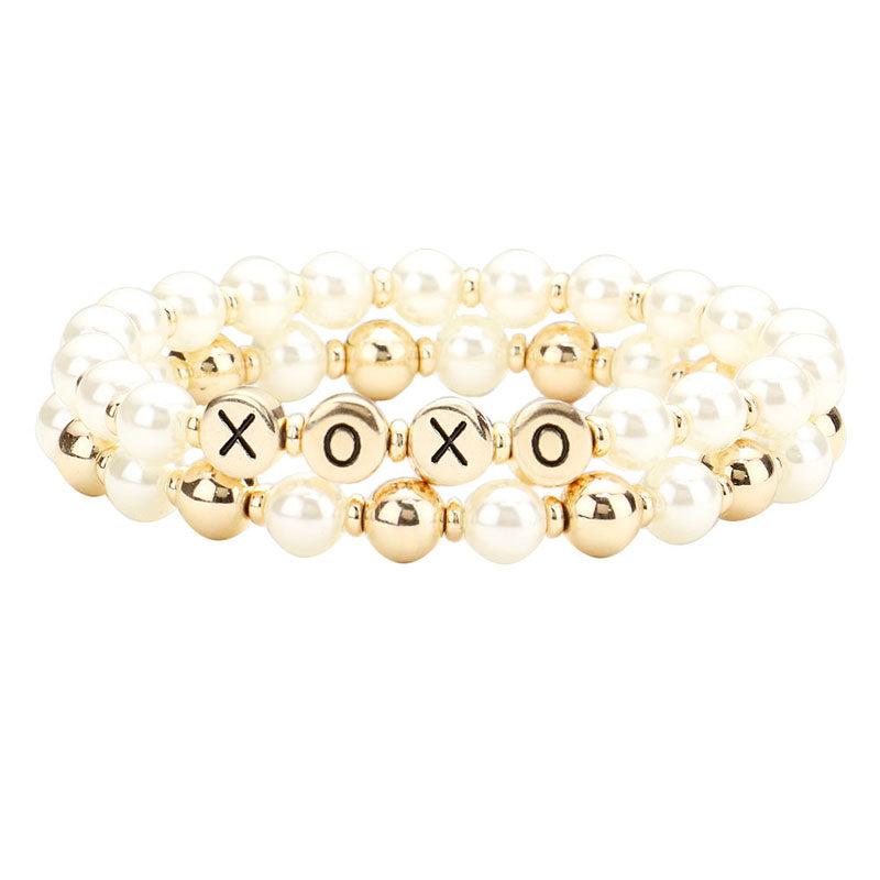 Gold XOXO Pearl Metal Ball Stretch Message Bracelets. Look like the ultimate fashionista with these bracelets! Add something special to your outfit this Valentine! special It will be your new favorite accessory. Perfect Birthday Gift, Anniversary Gift, Mother's Day Gift, Graduation Gift, Valentine's Day Gift.