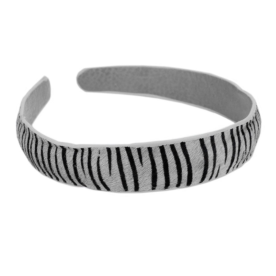 Gray Zebra Pattern Genuine Leather Headband, extract your glamour with an awesome look. Push back your hair with this zebra pattern headband to show you up in a stylish way. Spice up any plain outfit and be ready to receive compliments. Be the ultimate trendsetter wearing this chic headband with all your stylish outfits! It's perfect for covering up a bad hair day! A beautiful gift for the persons you care about the most, even yourself! Stay fashionable.