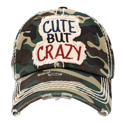 Green Cute But Crazy Message Camouflage Vintage Baseball Cap. This adorable and classic cap combines both colourful styles to turn your head and comfort for your all-day wear. perfect to keep your hair away from you face while exercising, running, playing tennis or just taking a walk outside. Adjustable Velcro strap gives you the perfect fit.