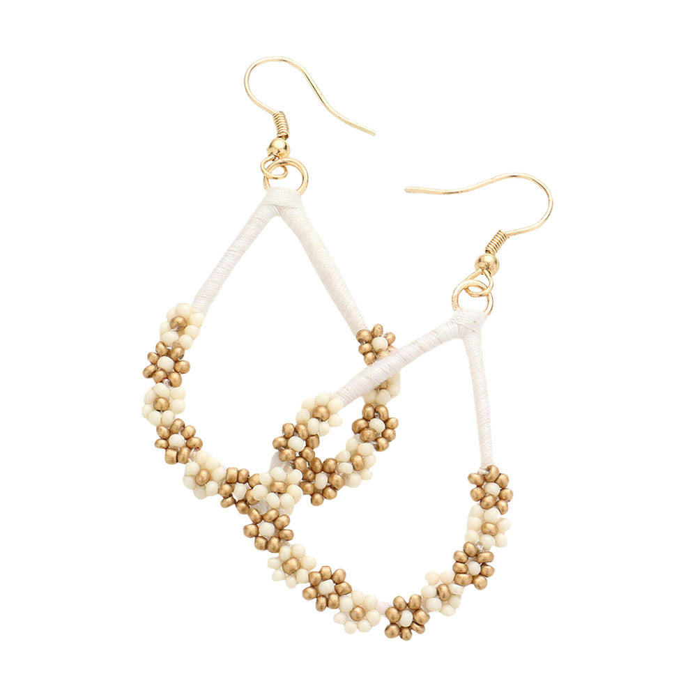 Ivory Floral Seed Beaded Open Teardrop Dangle Earrings, Fashionable beaded dangle earrings for women are designed into a teardrop shape. They are the perfect addition to your earrings collection. These adorable floral details teardrop dangle earrings are bound to cause a smile. You will absolutely love these beaded earrings! They are exactly what you were looking for; This jewelry is just the right accessory to finish off any outfit.
