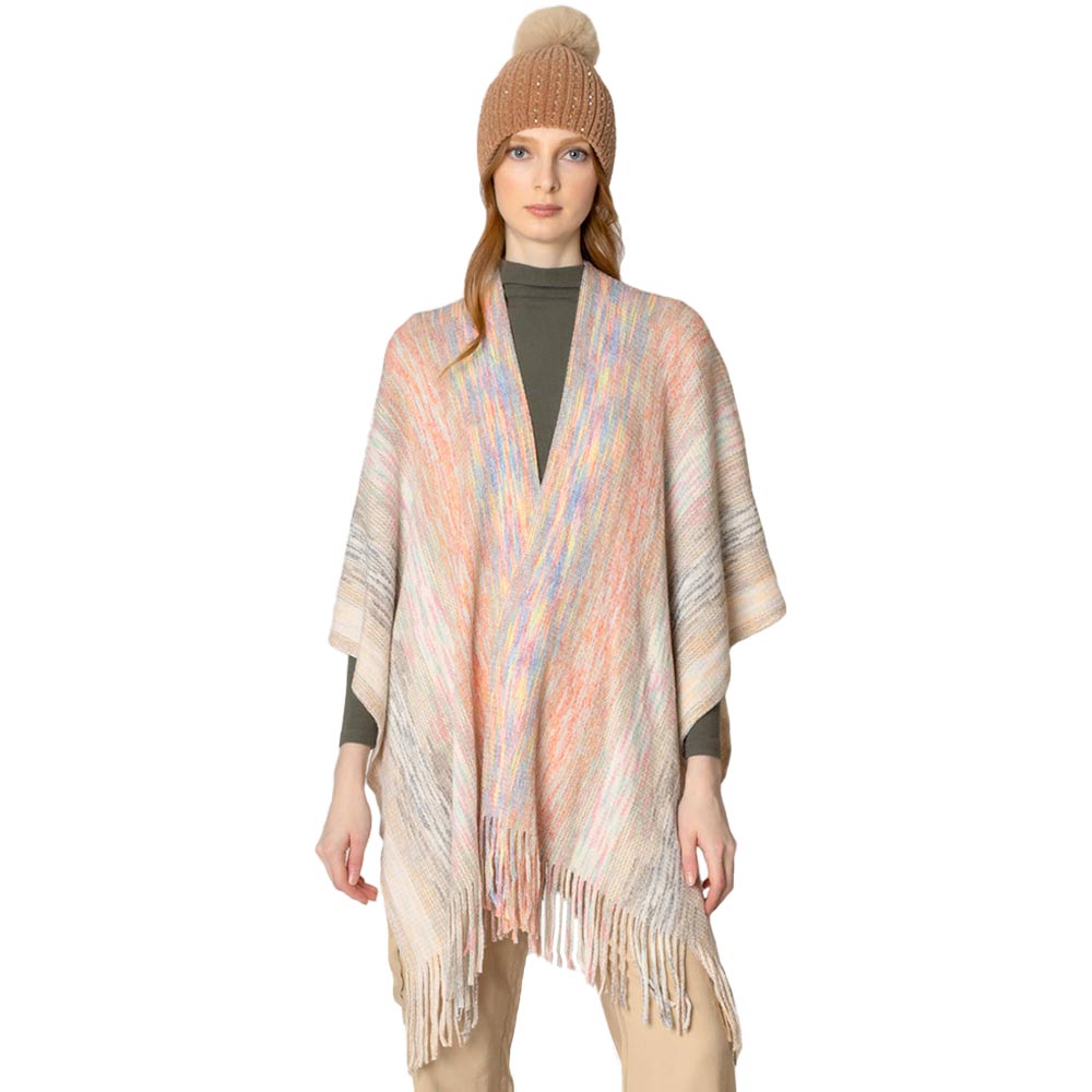 Ivory Multi Colored Metallic Knit Ruana, you can draw attention to the contrast of different outfits. Awesome multi-colored knit Ruana with a Fringe design that gives it a unique decorative and modern look. Match well with jeans and T-shirts or a vest. A fashionable, eye catcher, and useful wear that will quickly become one of your favorite accessories. It keeps you perfectly warm and goes well with all your winter outfits. Enjoy the winter in style!