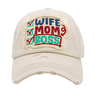 Ivory Wife Mom Boss Vintage Baseball Cap. Fun cool vintage cap perfect for who is in charge of the home, it is an adorable baseball cap that has a vintage look, giving it that lovely appearance. These stylish vintage caps all feature catchy message themes that are sure to grab some attention. The perfect gift for all occasions! These baseballs are available in a wide variety of designs. Whether you're looking for a holiday present, birthday present, or just something cool to wear, this hat is for you.