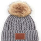 Light Grey C.C Double Braided Beanie Faux Fur Pom Pom & Leather Patch Winter Hat; reach for this classic toasty hat to keep you nice n warm in the chilly winter weather, the wintry touch finish to your outfit. Perfect Gift Birthday, Christmas, Holiday, Anniversary, Stocking Stuffer, Secret Santa, Valentine's Day, Loved One, BFF