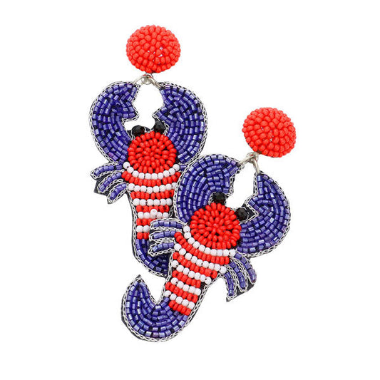 Multi Felt Back American USA Flag Lobster Beaded Dangle Earrings. Show your love for our country with this  patriotic USA style American Flag Earrings. Featuring red, white and blue for a bit of fashionable fireworks flair. With these Sea Life lobster themed earring rock every party you attend to. Goes with any of your casual outfits and Adds something extra special. Great gift idea for your Loving One.