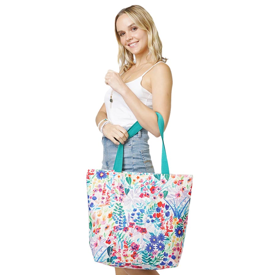 Multi Flower Patterned Beach Tote Bag, Sturdy and stylish with a flower patterned tote bag. Whether you are out shopping or going to the pool or beach, this flower-patterned tote bag is the perfect accessory. Perfectly lightweight to carry around all day. Spacious enough for carrying any of your hangout essentials. 