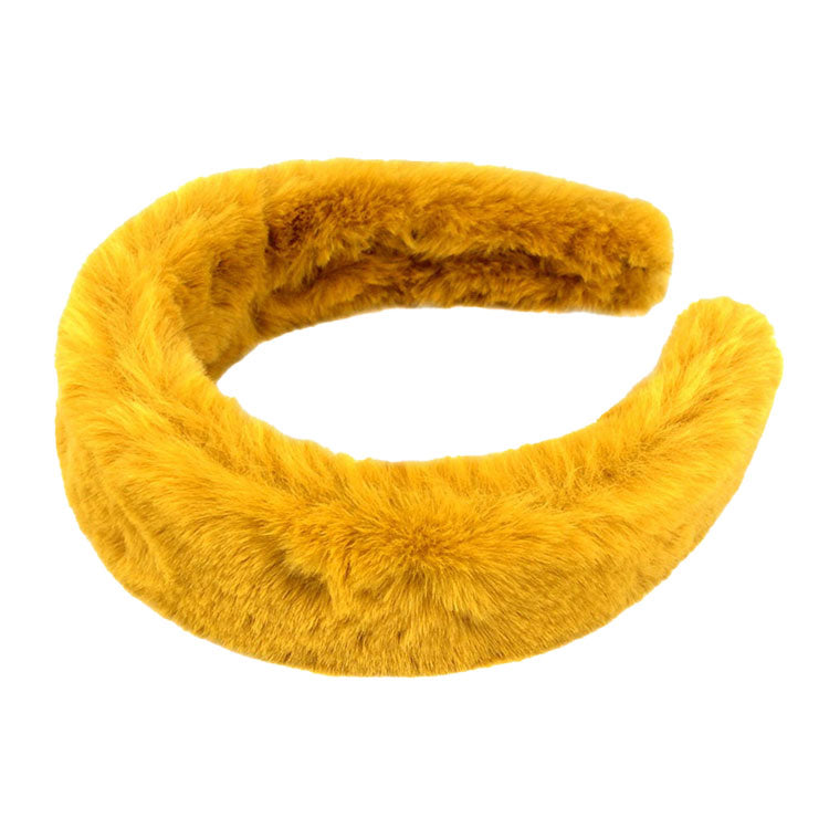 Mustard Trendy Fashionable Solid Faux Fur Headband. Create a natural look while perfectly matching your color with the easy to use Faux Fur  Headband. Adds a super neat and trendy twist to any boring style. Perfect for everyday wear; special occasions, outdoor festivals and more. Available in a variety of colors!